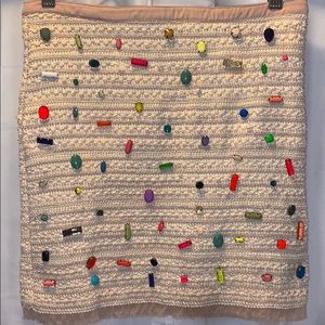 A-line cream skirt with sewn in jewels.